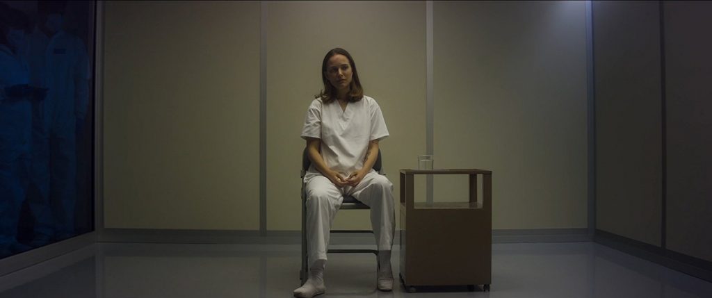 Natalie Portman sits alone in shock as she recounts her memories of The Shimmer.