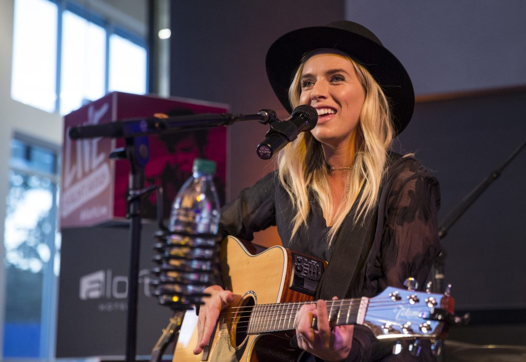 ZZ Ward playing guitar at Aloft Seattle Redmond