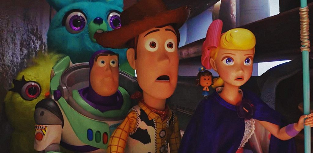 Movie still from Toy Story 4 showing Woody, Buzz Lightyear, and Bo Peep