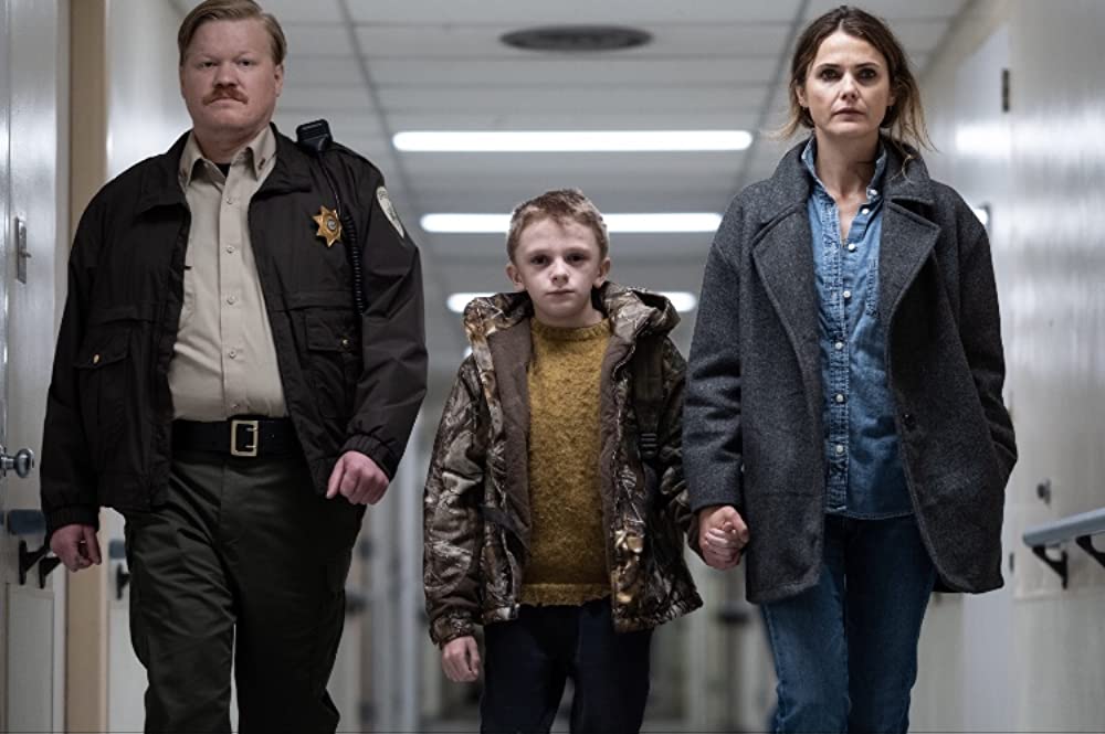 Part of the case of Antlers (2021), Jesse Plemons, Jeremy T. Thomas, and Keri Russell.